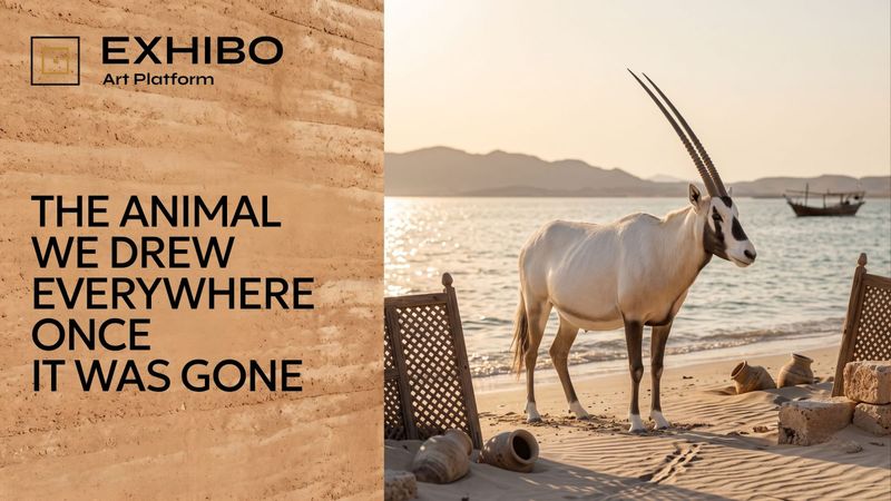 An Arabian oryx, white with long nearly straight ringed horns and dark facial markings, standing in pale desert sand.