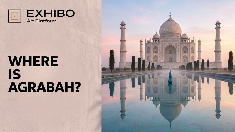 The white marble dome and framing minarets of the Taj Mahal in Agra, mirrored in the still water of its reflecting pool at dawn.