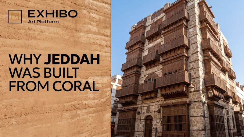 A tall coral-stone merchant house in Jeddah's Al-Balad, its façade lined with projecting latticed teak rawasheen.