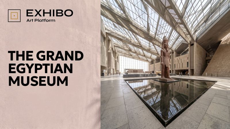 The colossal statue of Ramses II standing in the sunlit atrium of the Grand Egyptian Museum, reflected in the shallow pool at its base, with daylight falling through the roof.